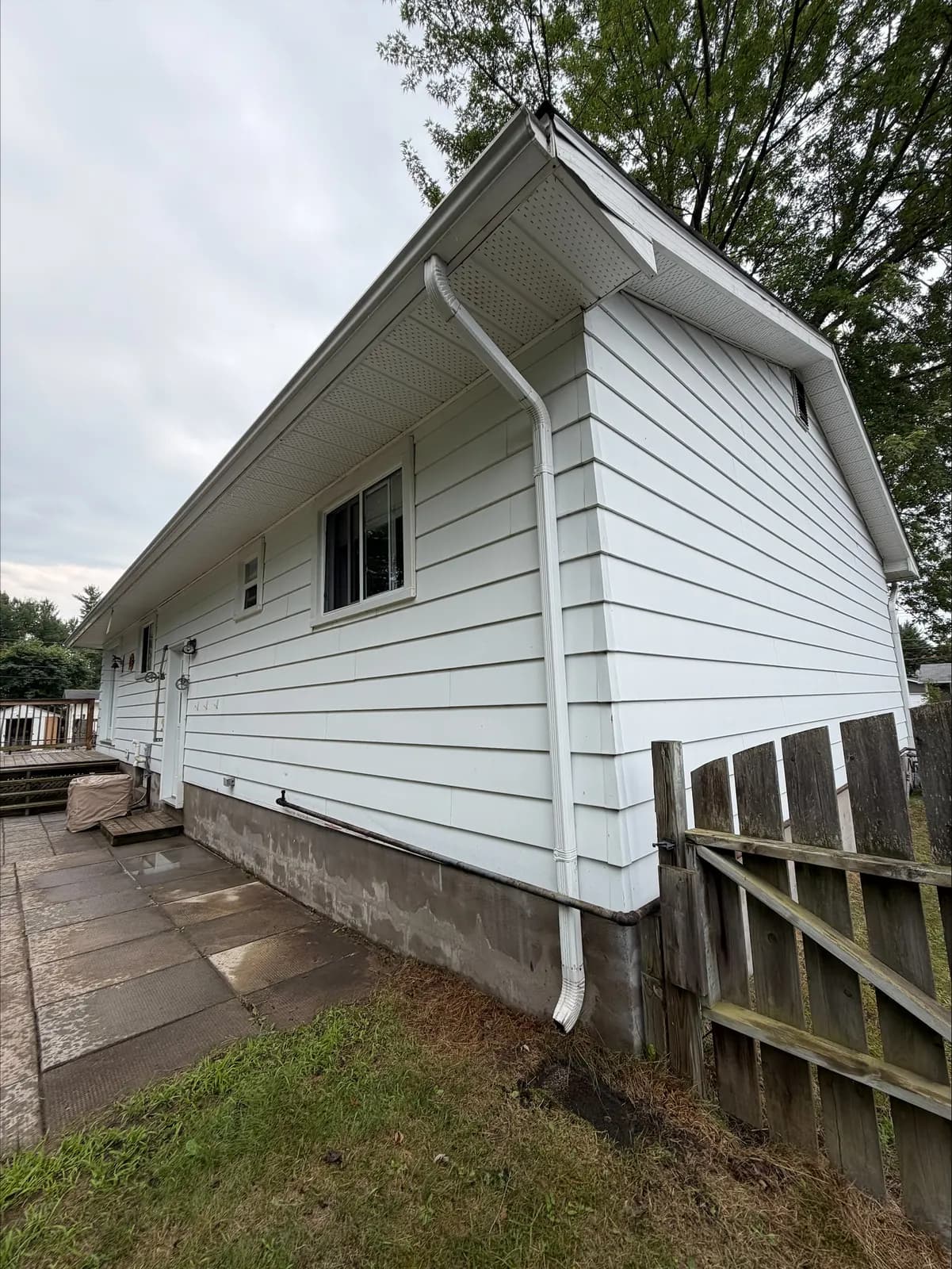 Gleaming white siding and soffit after an exterior house wash near Pembroke