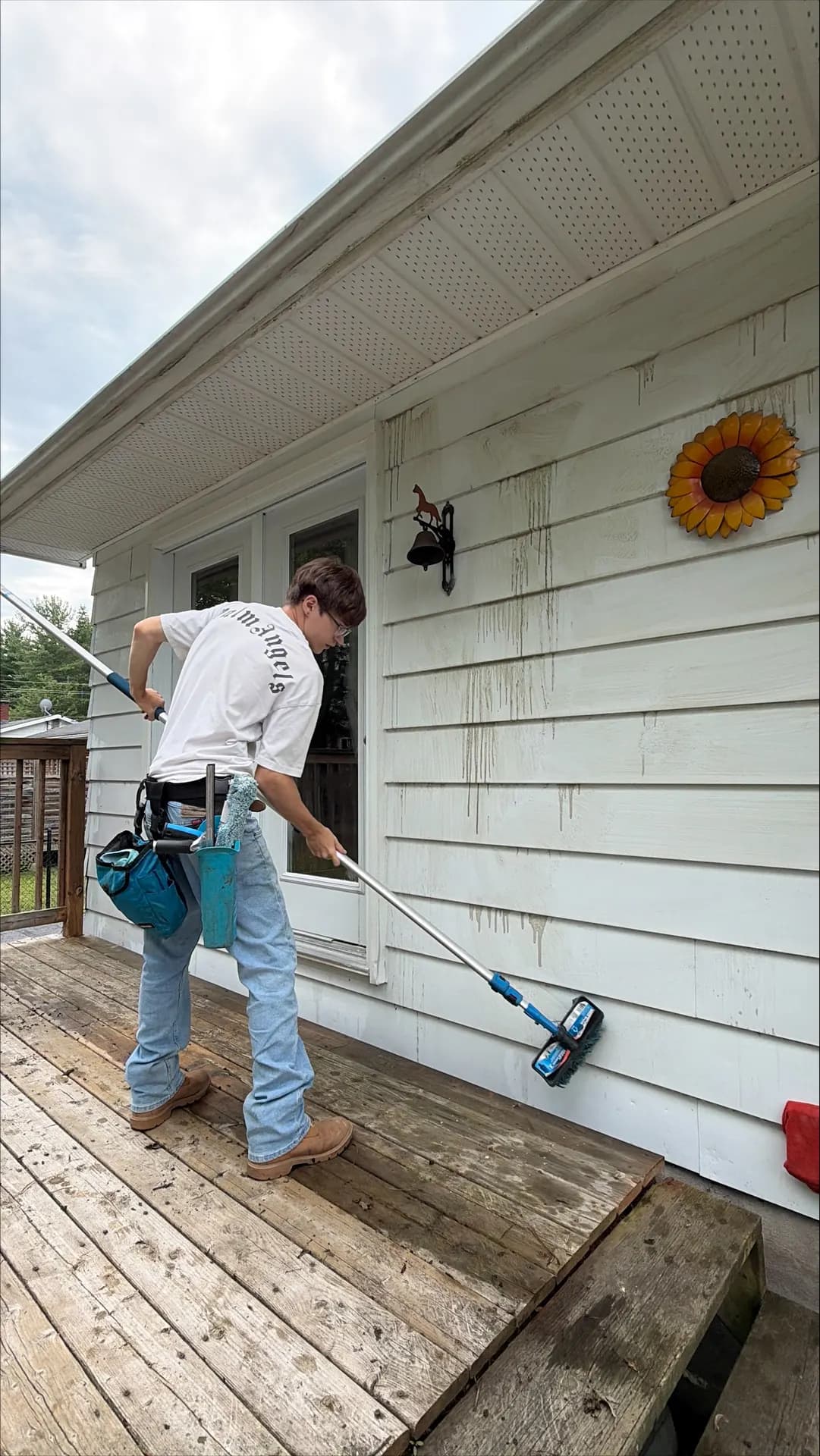 Half-cleaned wall showing the before and after difference during a soft wash near Petawawa