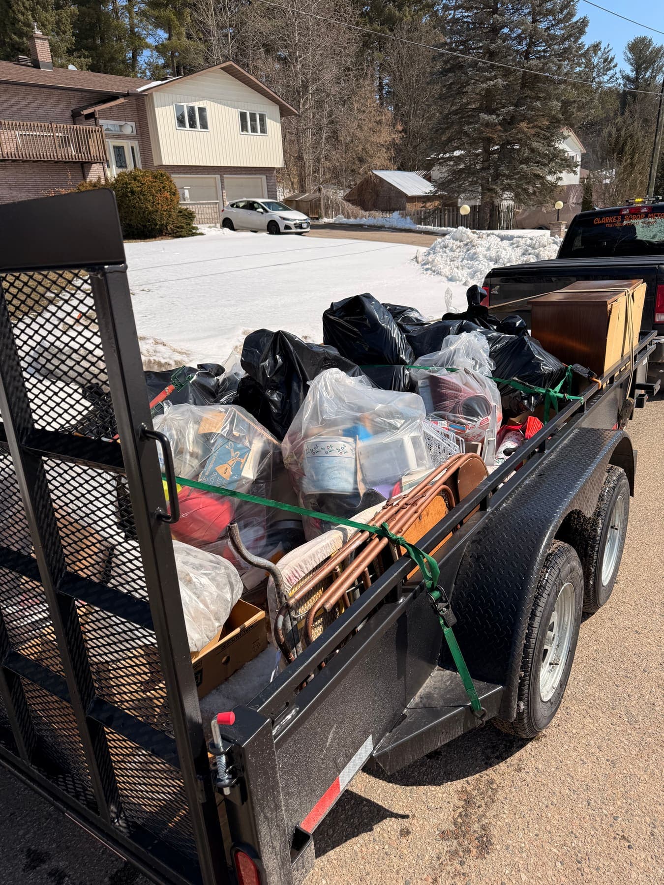 PVS trailer loaded with junk and debris ready for disposal