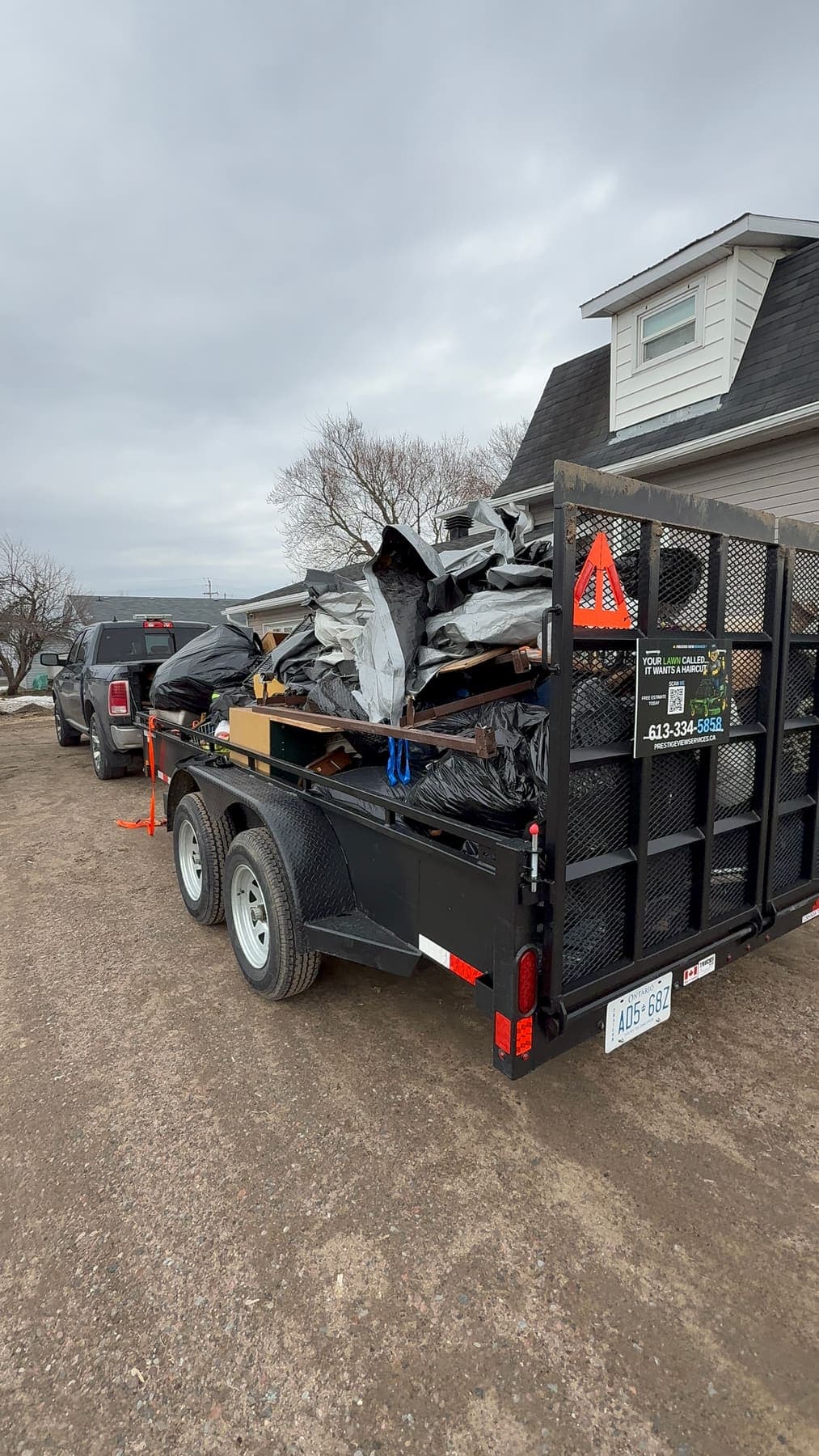 PVS trailer loaded with junk and debris ready for disposal
