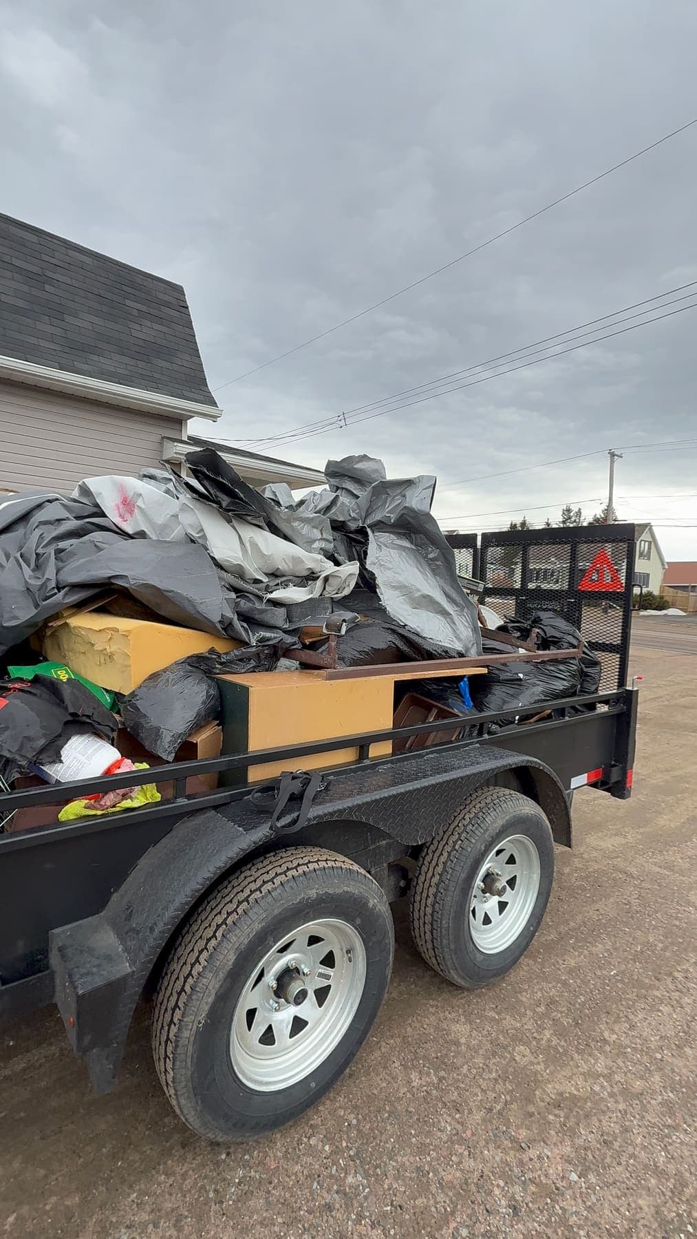 PVS trailer loaded with junk and debris ready for disposal