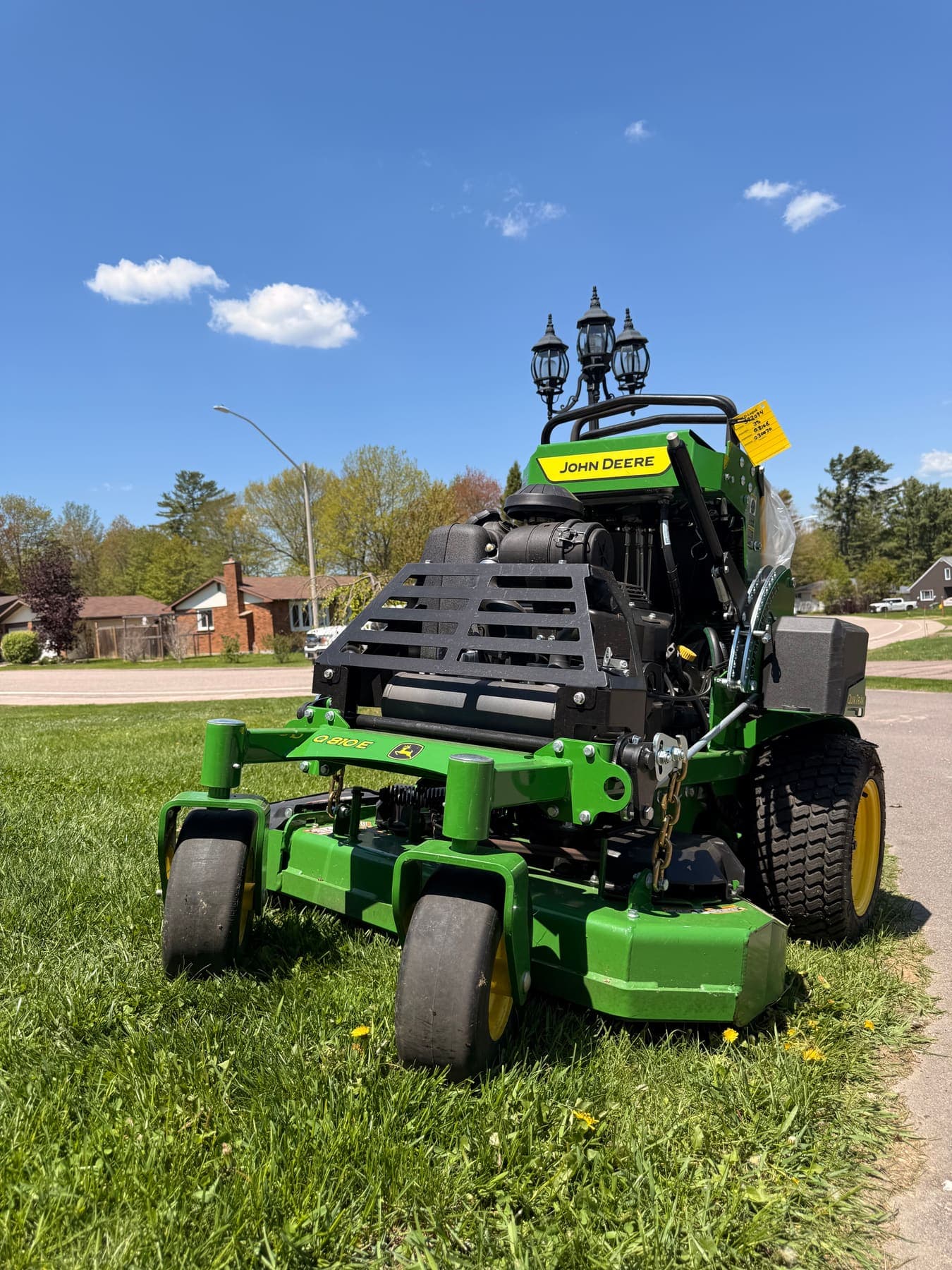 PVS lawn care crew mowing a residential lawn, Ottawa Valley