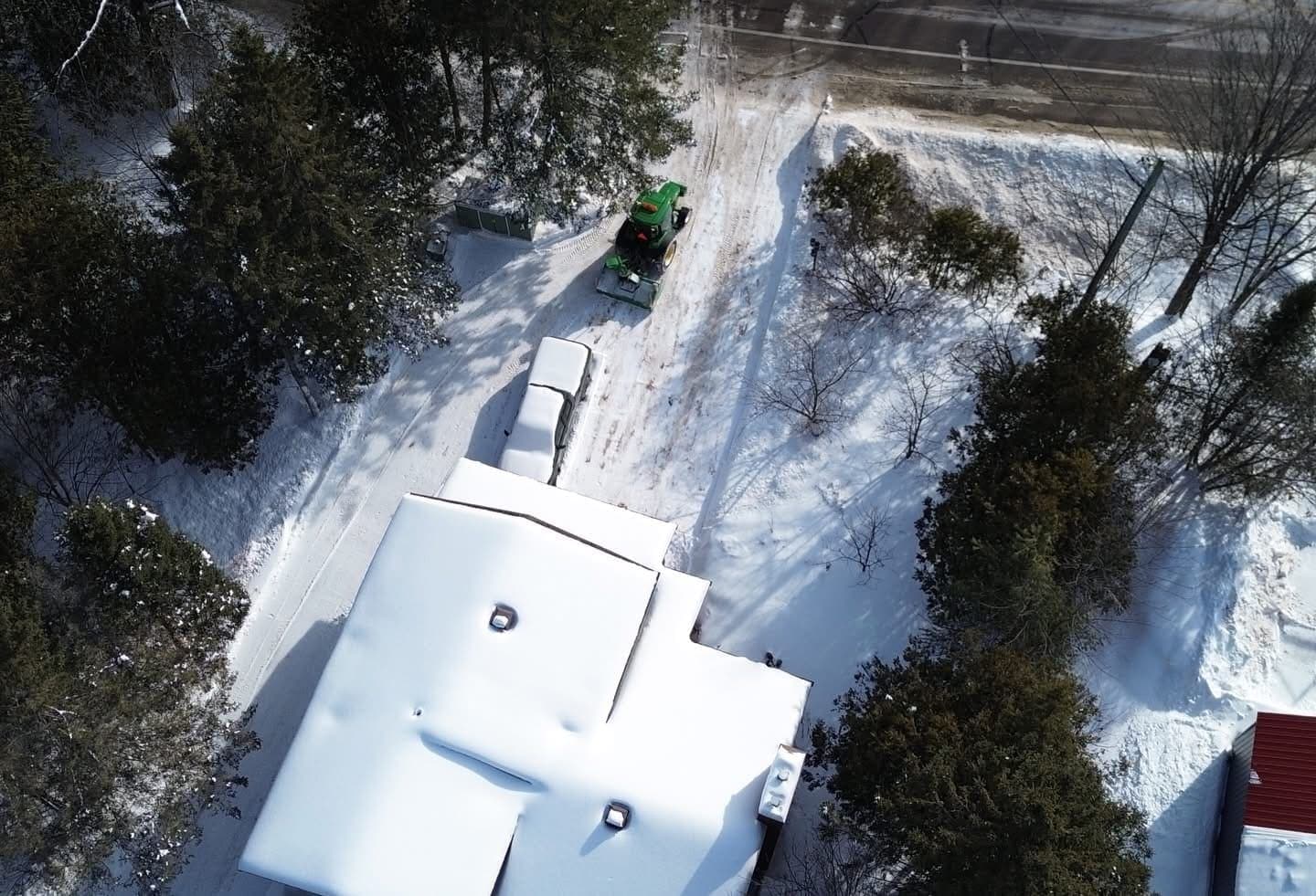 PVS snow removal crew clearing a property after a snowfall, Ottawa Valley