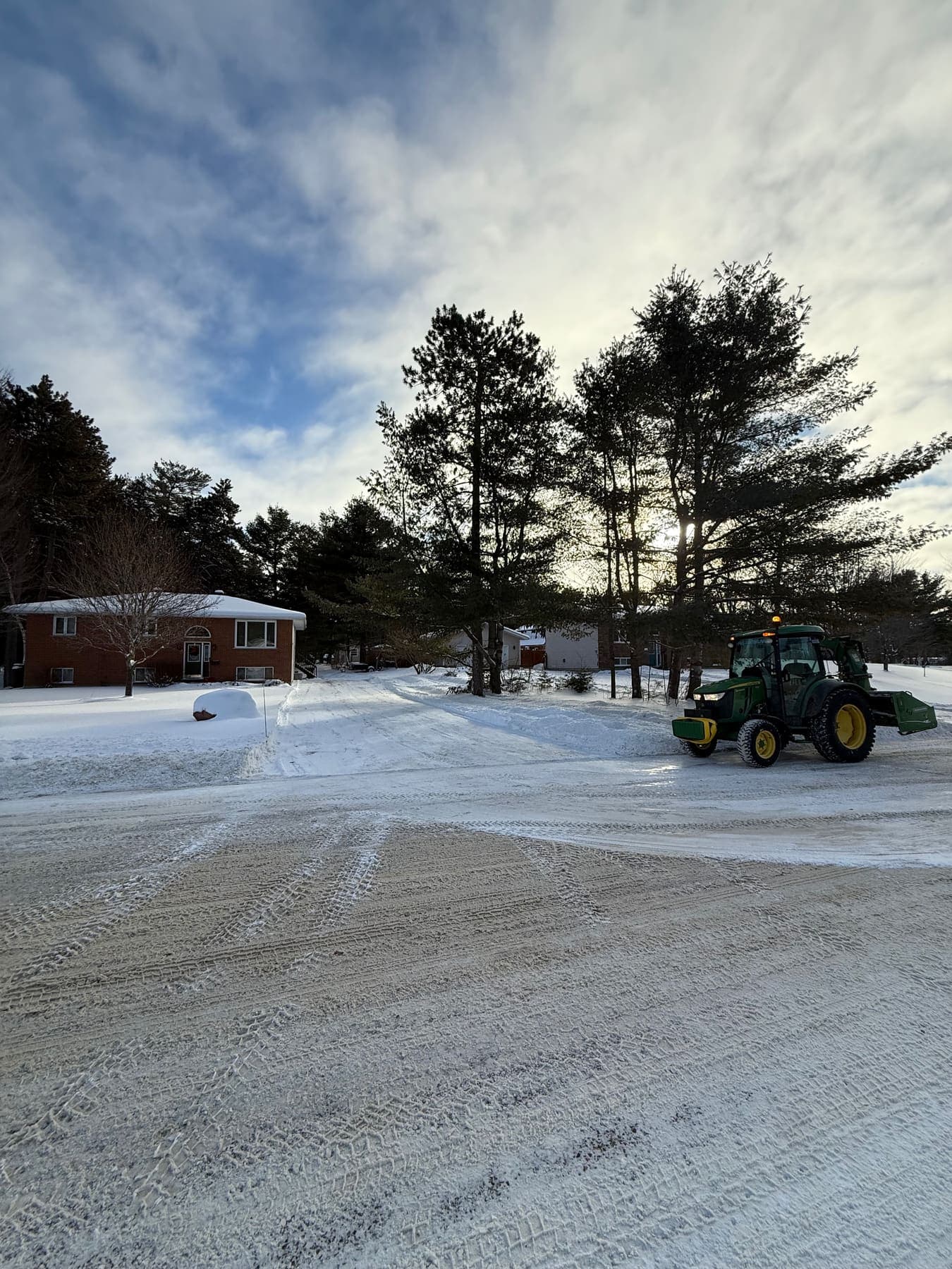 PVS snow removal crew clearing a property after a snowfall, Ottawa Valley