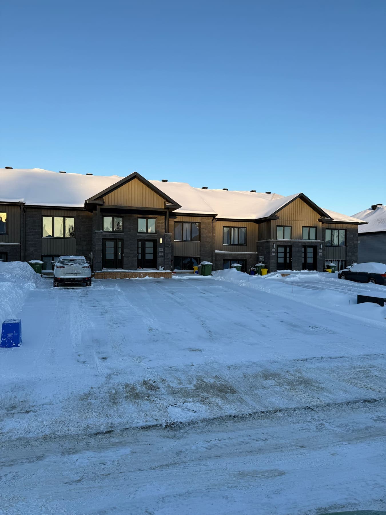 PVS snow removal crew clearing a property after a snowfall, Ottawa Valley