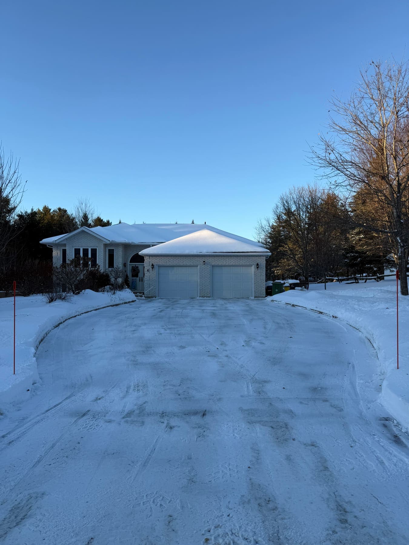 PVS snow removal crew clearing a property after a snowfall, Ottawa Valley
