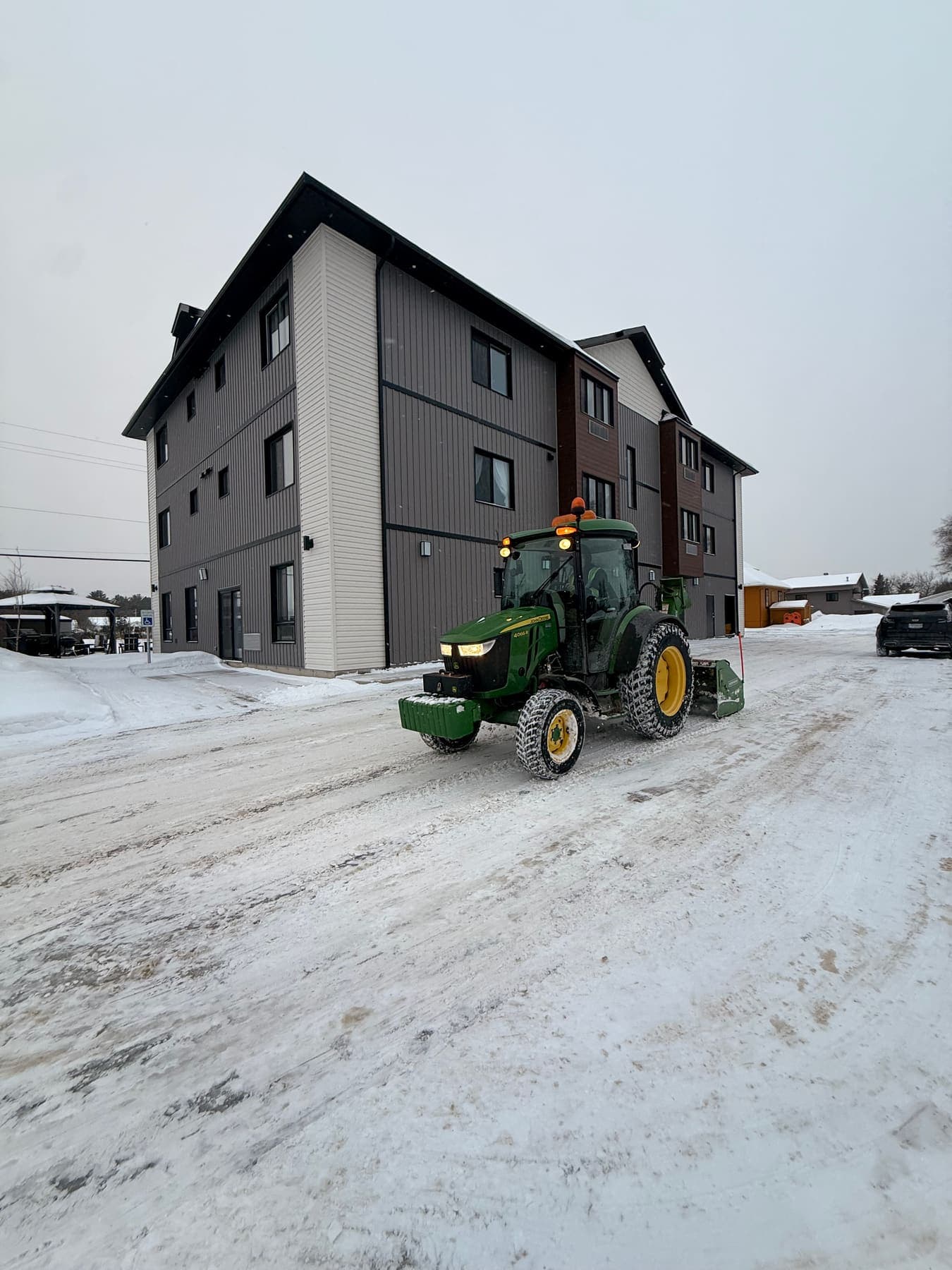 PVS snow removal crew clearing a property after a snowfall, Ottawa Valley