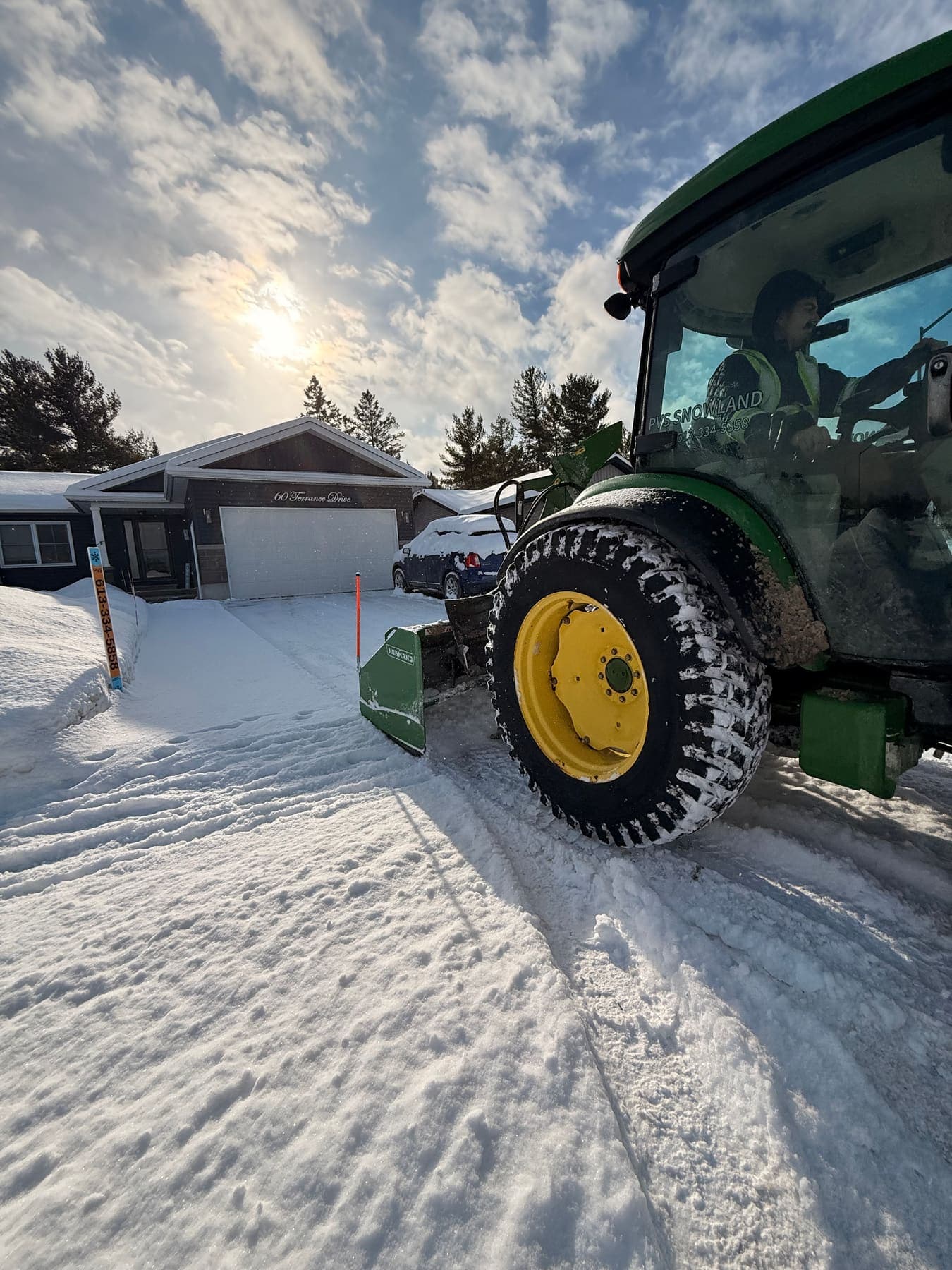 PVS snow removal crew clearing a property after a snowfall, Ottawa Valley