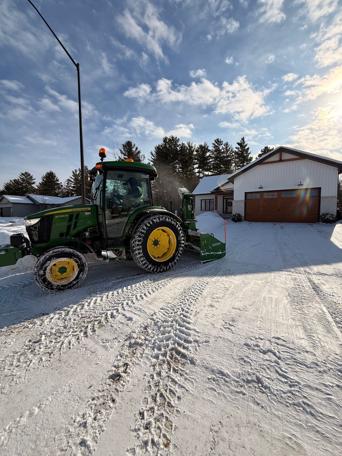 PVS snow removal crew clearing a property after a snowfall, Ottawa Valley