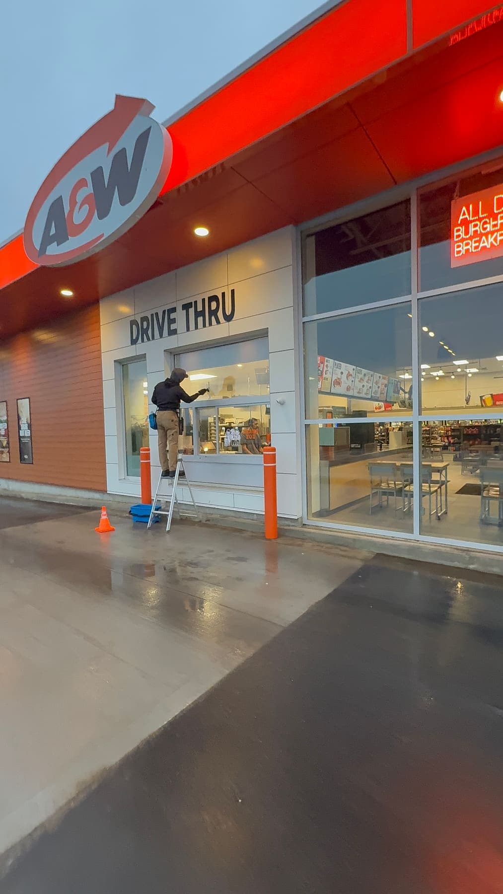 PVS team cleaning A&W drive-thru window