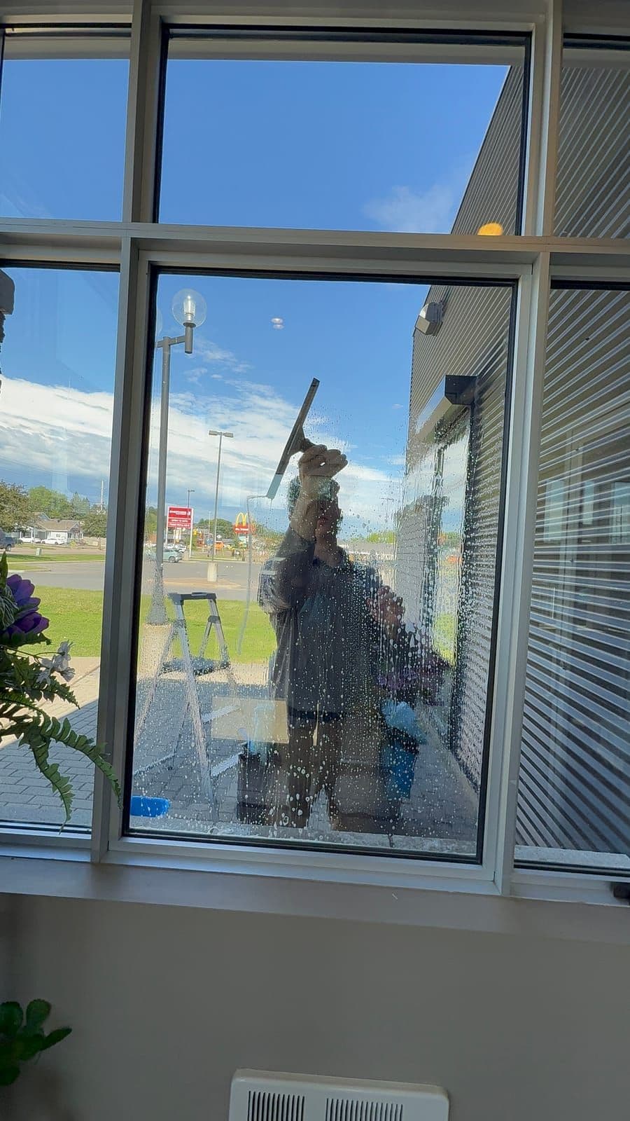 Floor-to-ceiling commercial windows cleaned streak-free by Prestige View Services in Pembroke