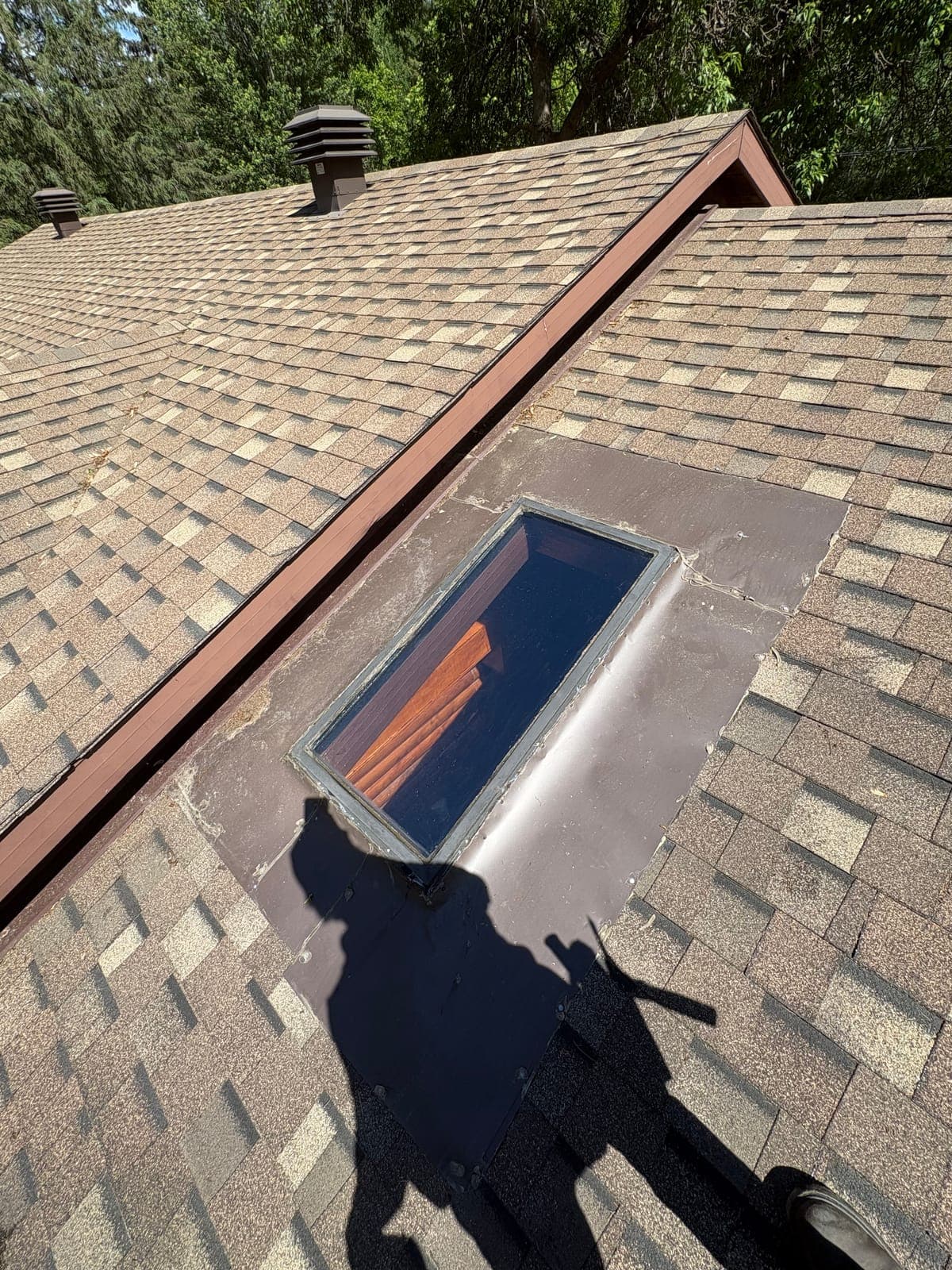 Clean skylight reflecting roofline and sky after PVS cleaning